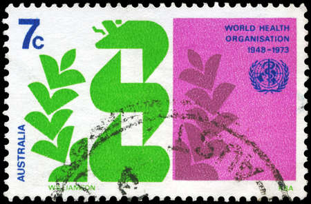 AUSTRALIA - CIRCA 1973: A Stamp printed in AUSTRALIA shows the Caduceus and Laurel Wreath, 25th Anniversary of the World Health Organization, circa 1973の写真素材