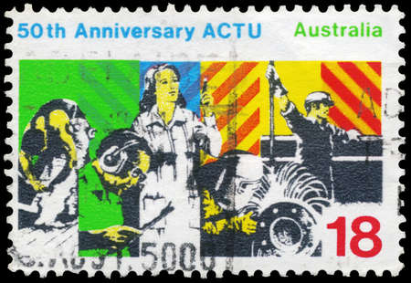 AUSTRALIA - CIRCA 1977: A Stamp printed in AUSTRALIA shows the Workers, Australian Council of Trade Unions (ACTU), 50th anniversary, circa 1977のeditorial素材