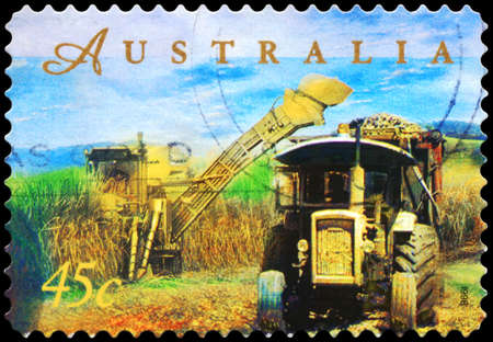 AUSTRALIA - CIRCA 1998: A Stamp printed in AUSTRALIA shows the Sugar Cane Harvesting, Farming series, circa 1998の写真素材