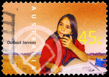 AUSTRALIA - CIRCA 2001: A Stamp printed in AUSTRALIA shows the School of the Air Pupil, Outback Services, series, circa 2001のeditorial素材