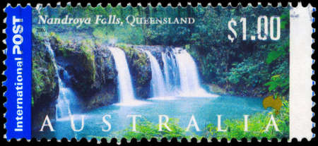 AUSTRALIA - CIRCA 2000: A Stamp printed in AUSTRALIA shows the Nandroya Falls, Queensland, series, circa 2000のeditorial素材