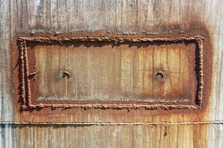 Rusty metal surface with welding patchの写真素材