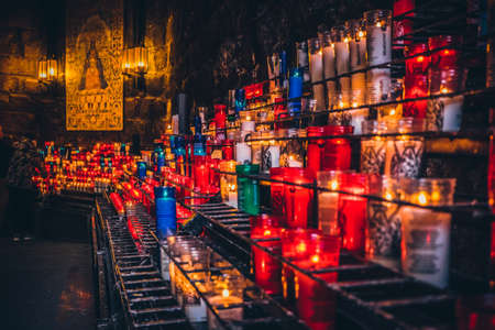 Candles in Montserrat monastery on mountain in Barcelona, Cataloniaのeditorial素材