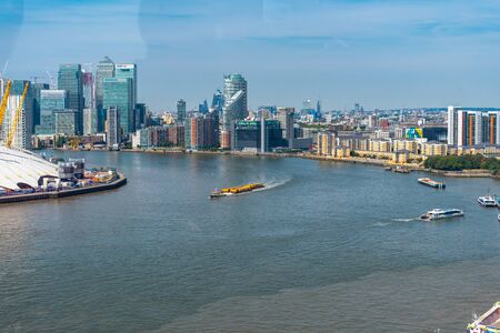 Emirates Air Line cable cars on thames river in London, UK.の写真素材