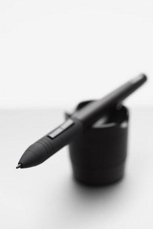 Pen of wireless graphic tablet on a pen holder