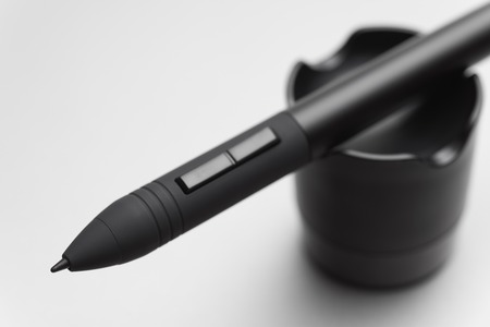 Pen of wireless graphic tablet on a pen holderの写真素材