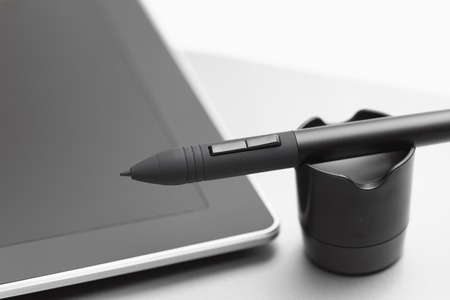 Pen of wireless graphic tablet on a pen holderの写真素材