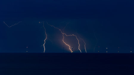 Lightning strike on the sea at night. Thunderstorm over the sea.の写真素材