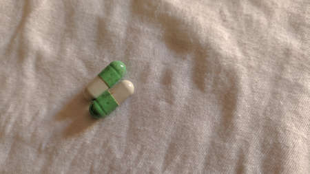 close up of a white pill on white backgroundの写真素材
