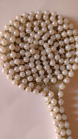 Stock Photo - Beautiful pearl necklace closeup on white backgroundの写真素材