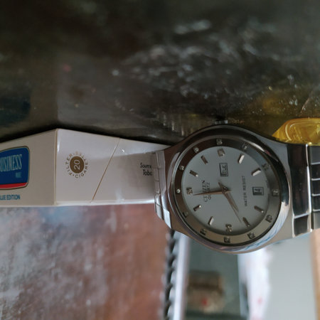 Close up of a clock on a coffee machine in a coffee shopの写真素材