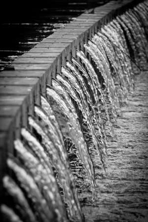 Waterfall Curtain and stone damの写真素材