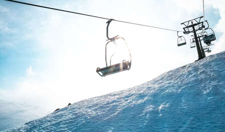 Ski lift chairs on bright winter day