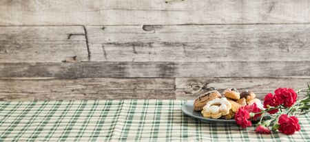 Festive time with home made cookies on the wodden table with wooden backgroundの写真素材