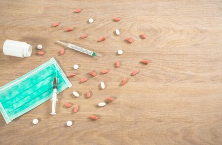 Fighting against new epidemic virus corona with vaccination and pillsの写真素材