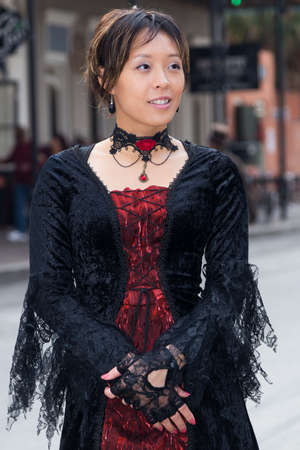 Portrait of asian girl in black Victorian dressの写真素材