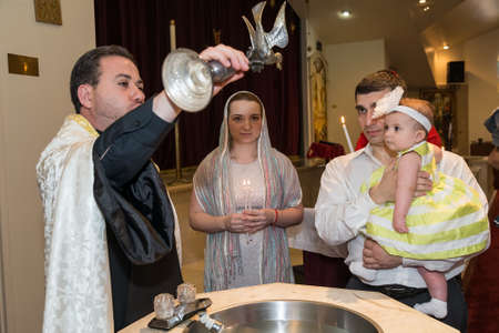 HOUSTON, TX/USA - 04 04 2015: Christian Baptising a girl in St. Kevork Armenian Church in Houston,...