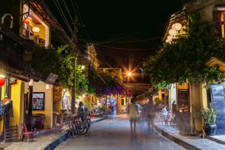 HOI AN, VIETNAM - CIRCA AUGUST 2015: People walking on the streets of old town Hoi An, Vietnam by nightのeditorial素材