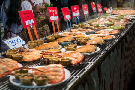 CHIANG MAI, THAILAND - CIRCA AUGUST 2015: Local people sell traditional Thai food and drinks at night market in Chiang Mai, Thailandのeditorial素材