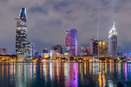 HO CHI MINH CITY, SAIGON/VIETNAM - CIRCA AUGUST 2015: Lights of Saigon downtown skyline are reflected in the riverのeditorial素材