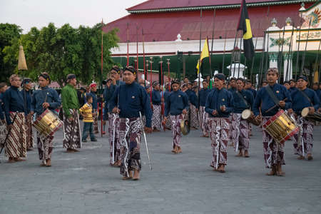 YOGYAKARTA, INDONESIA - CIRCA SEPTEMBER 2015: Ceremonial Sultan Guards in sarongs march in front of Sultan Palace (Keraton), Yogyakarta, Indonesiaのeditorial素材