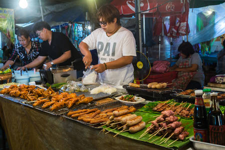 CHIANG MAI, THAILAND - CIRCA AUGUST 2015: Local people sell traditional Thai food and drinks at night market in Chiang Mai, Thailandのeditorial素材