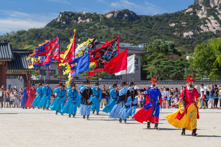 Seoul, South Korea - circa September 2015: Palace guards marching in traditional Korean dresses in Gyeongbokgung Palace, Seoul, Koreaのeditorial素材