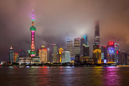 Shanghai, China - circa September 2015: Skyline of Shanghai in clouds by nightのeditorial素材