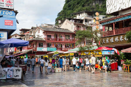 Yangshuo, China - circa July 2015: Streets of tourist town Yangshuo on the banks of Li river in Chinaのeditorial素材