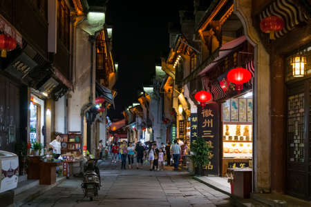 Huangshan Tunxi City, China - circa September 2015: Streets and shops of Old Town Huangshan by nightのeditorial素材