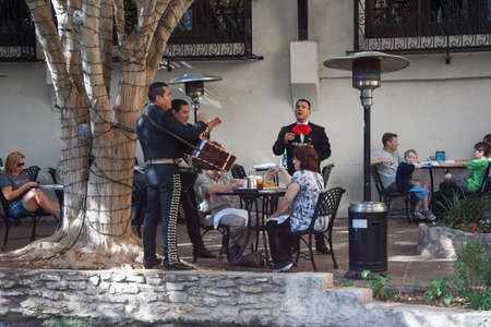 San Antonio, TX/USA - circa November 2011: Mexican Band plays for tourists inside the restaurant at River Walk in San Antonio, Texasのeditorial素材
