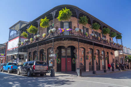 New Orleans, LA/USA - circa February 2016: Old Colonial House with ironwork galleries on the Streets of French Quarter decorated for Mardi Gras in New Orleans, Louisianaのeditorial素材