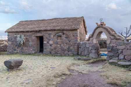 Cusco, Peru - circa June 2015: Stone Hut house and gate at the Peruvian village in the countryside, Andes Mountains, Peruのeditorial素材