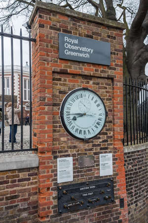 London, UK - circa March 2012: Shepherd 24-hour Gate Clock and Public standards of length in Royal Greenwich Observatoryのeditorial素材