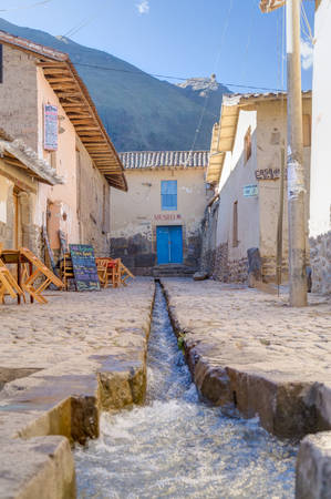 Ollantaytambo, Urubamba/Peru - circa June 2015: Museum and stream at the street of Ollantaytambo Inca town, Peruのeditorial素材