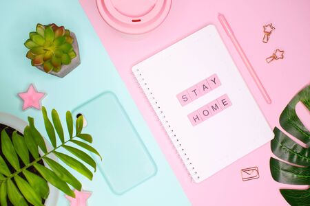 Concept flat lay. Words stay home made of pink wooden letters