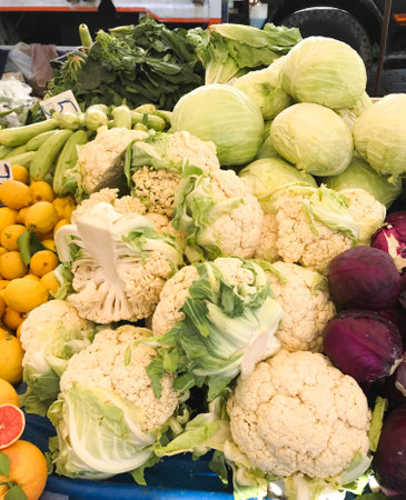 Fresh cabbage, red cabbage and broccoli on the market counter