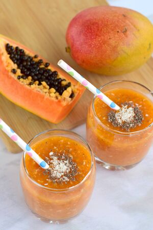 Mango papaya coconut smoothieの写真素材