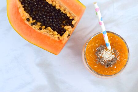 papaya coconut smoothie in a glassの写真素材