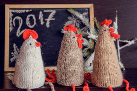 knitted cocks - the symbol of the new year 2017の写真素材