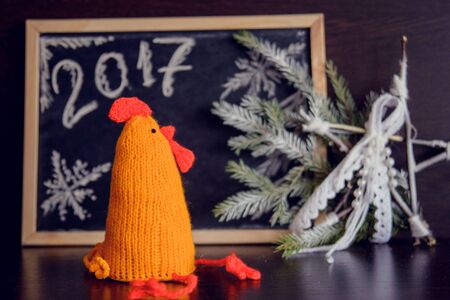 knitted cocks - the symbol of the new year 2017の写真素材
