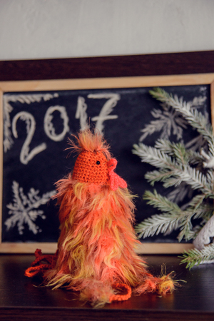 knitted cocks - the symbol of the new year 2017の写真素材
