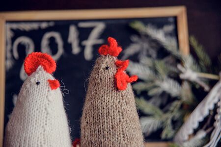 knitted cocks - the symbol of the new year 2017の写真素材