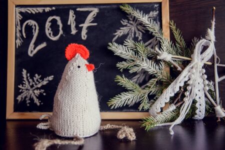 knitted cocks - the symbol of the new year 2017の写真素材