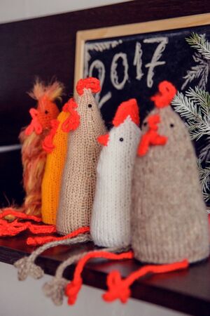 knitted cocks - the symbol of the new year 2017の写真素材
