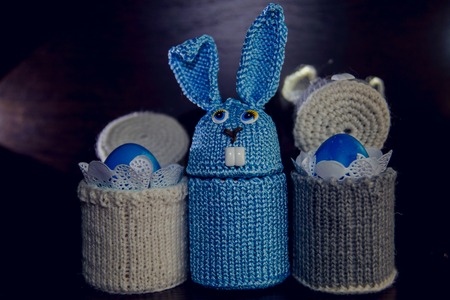 Easter eggs, rabbit and catkins on a wooden backgroundの写真素材