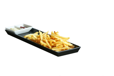French fries with ketchup on black plate