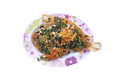 Stir fried deep  tilapia with  fired crispy herb leaf and peanut
