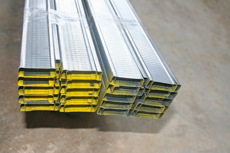 Aluminium rectangle shape with hollow are stacks on concrete floor.prepare for make ceiling.の写真素材