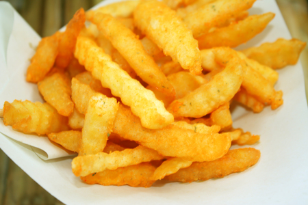 French fries on white papaerの写真素材